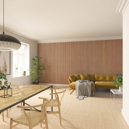 Lamellenwand achter een bank in een woonkamer.