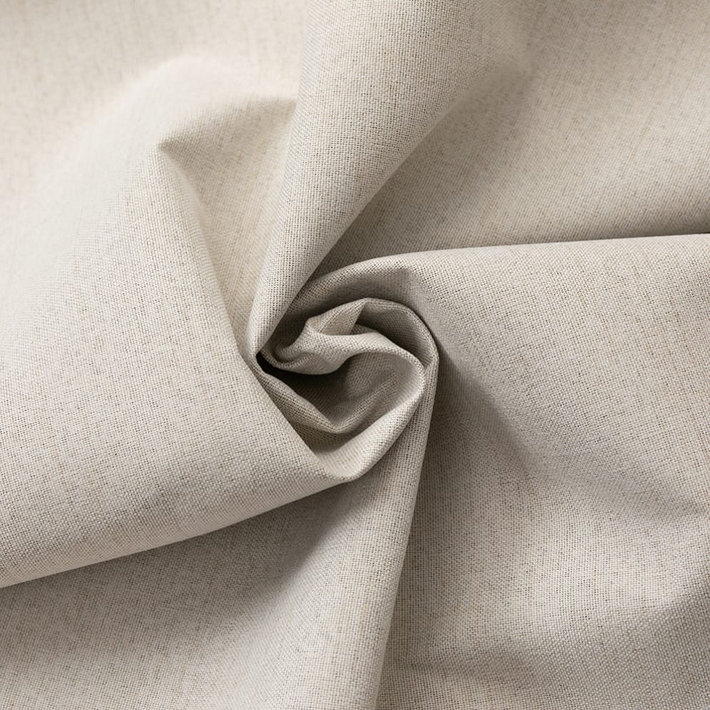 Detail van beige stof die in een spiraal is geplooid.